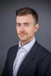 Portrait photo of Arseniy Braslavskiy in professional attire.